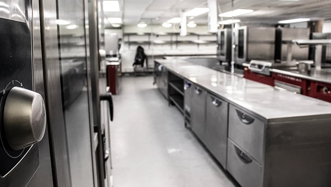 Industrial cleaning methods used to maintain hygiene standards in commercial kitchens.