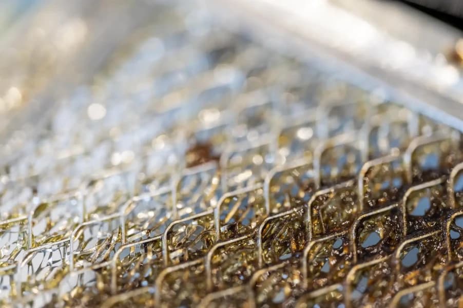 Commercial kitchen grease extraction system requiring professional filter maintenance.